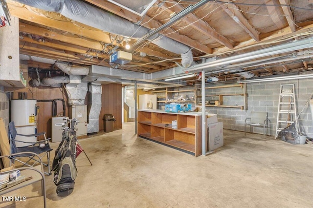 unfinished basement featuring water heater and concrete block wall