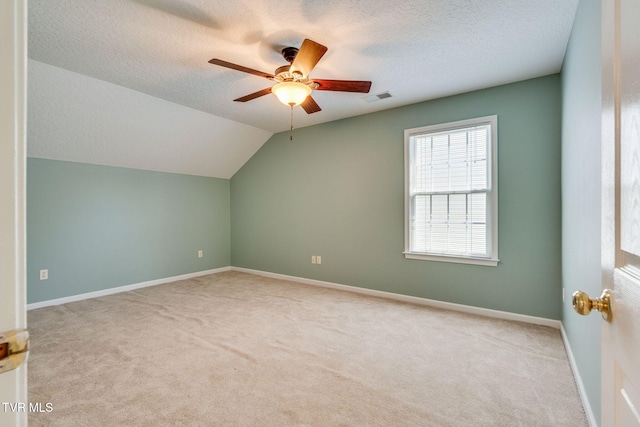 bonus room with ceiling fan, carpet flooring, a textured ceiling, and visible vents