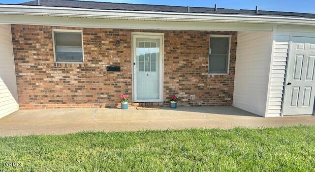 1544 Jessee St Unit S, Kingsport, TN 37664 - doorway to property with brick siding and a patio area