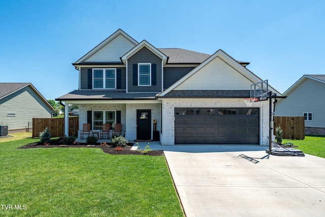 view of front of home with an attached garage, fence, a front yard, concrete driveway, and a porch