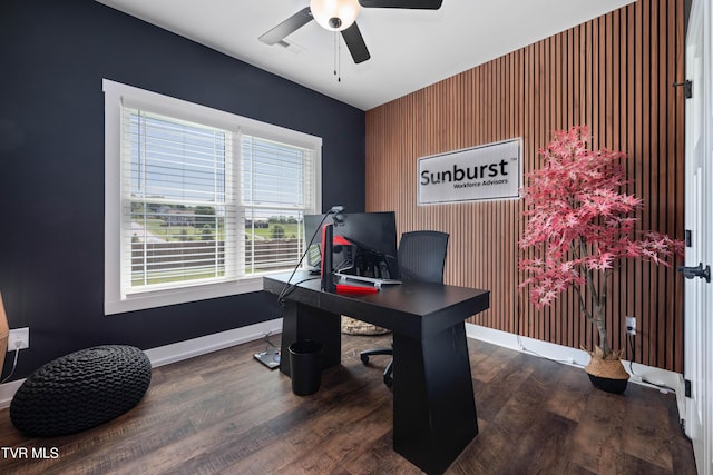 office space with baseboards, ceiling fan, wood finished floors, and visible vents