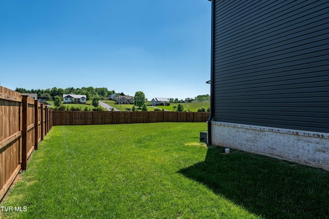 view of yard with a fenced backyard