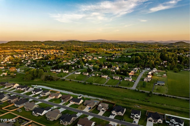 aerial view at dusk with a mountain view