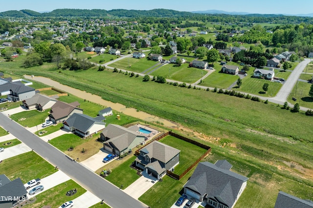 birds eye view of property with a residential view