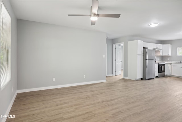 unfurnished living room featuring light wood-style floors, baseboards, and a ceiling fan