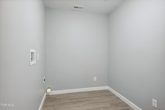 washroom featuring laundry area, washer hookup, light wood-style floors, baseboards, and visible vents