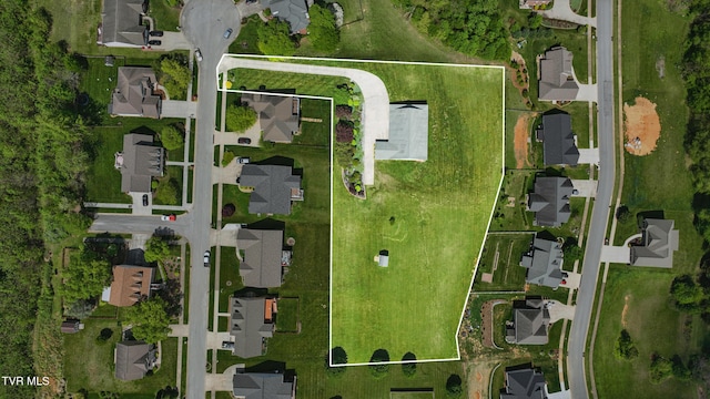 birds eye view of property with a residential view