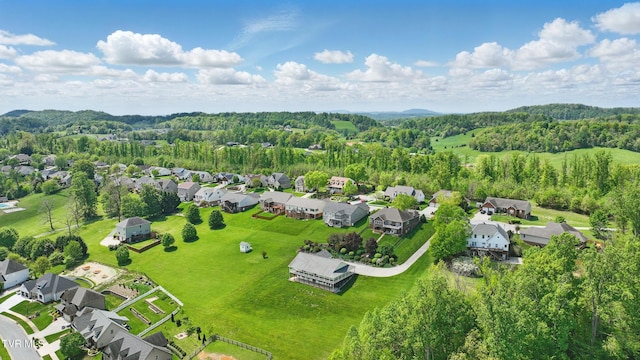 drone / aerial view with a residential view and a forest view
