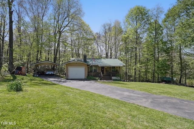 368 Burbank Rd, Roan Mountain, TN 37687 - single story home featuring a front lawn, a chimney, a detached carport, covered porch, and driveway