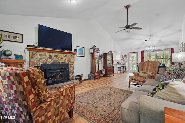 368 Burbank Rd, Roan Mountain, TN 37687 - living area with ceiling fan with notable chandelier, vaulted ceiling, and wood finished floors