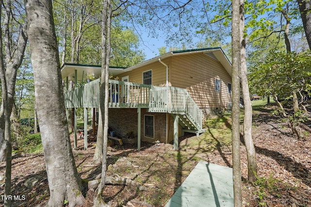 368 Burbank Rd, Roan Mountain, TN 37687 - rear view of house with stairway and a deck