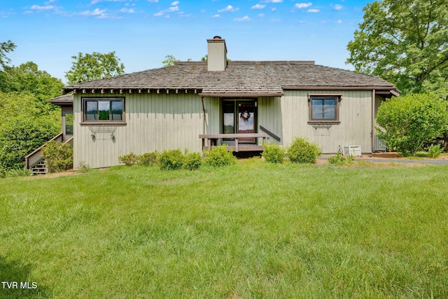 100 Periwinkle Pl Unit 100, Kingsport, TN 37660 - rear view of property with a chimney and a yard