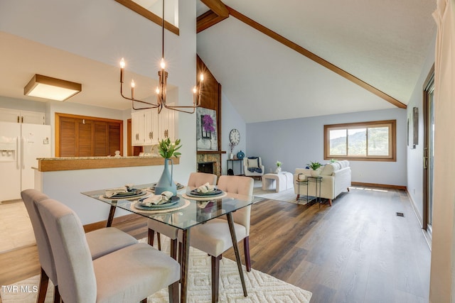 100 Periwinkle Pl Unit 100, Kingsport, TN 37660 - dining area with high vaulted ceiling, a chandelier, baseboards, wood finished floors, and beamed ceiling