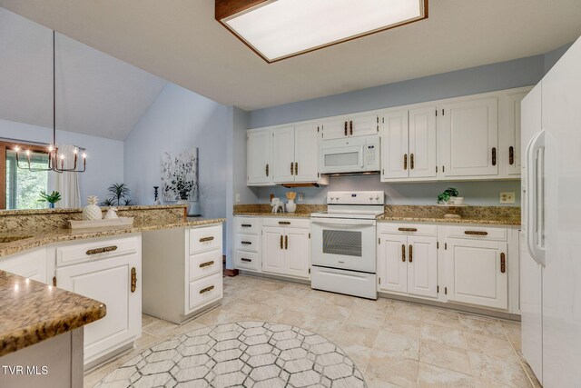 100 Periwinkle Pl Unit 100, Kingsport, TN 37660 - kitchen featuring white appliances, vaulted ceiling, white cabinets, light stone counters, and hanging light fixtures