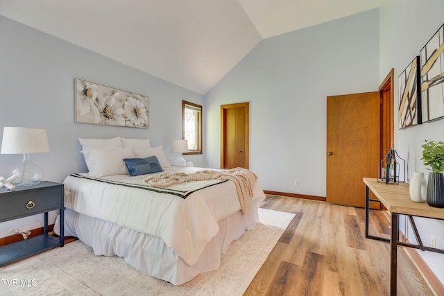 100 Periwinkle Pl Unit 100, Kingsport, TN 37660 - bedroom with high vaulted ceiling, light wood-style flooring, and baseboards