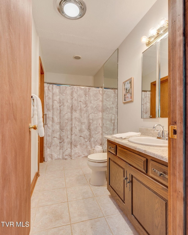 100 Periwinkle Pl Unit 100, Kingsport, TN 37660 - bathroom featuring tile patterned floors, toilet, vanity, and curtained shower