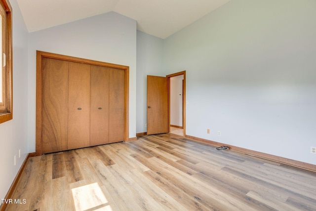 100 Periwinkle Pl Unit 100, Kingsport, TN 37660 - unfurnished bedroom featuring wood finished floors, a closet, baseboards, and high vaulted ceiling