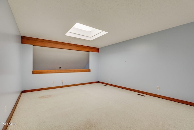 100 Periwinkle Pl Unit 100, Kingsport, TN 37660 - bonus room featuring a skylight, carpet flooring, and baseboards