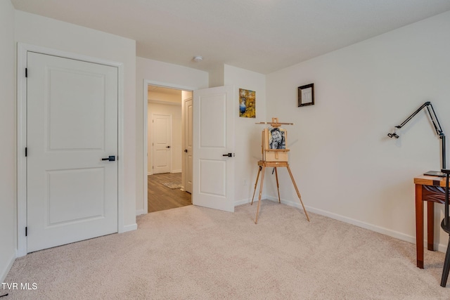 bedroom featuring carpet floors and baseboards