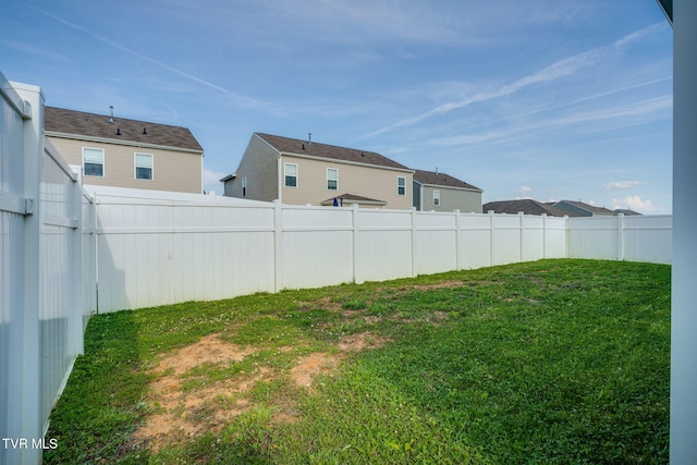 view of yard with a fenced backyard