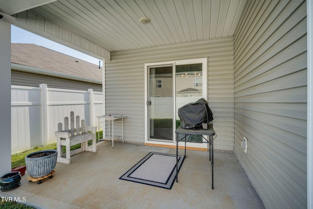 view of patio featuring fence