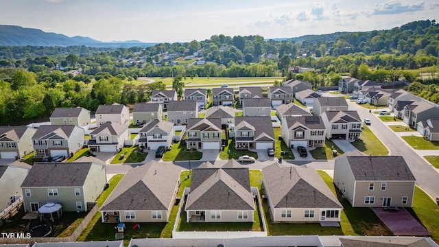 birds eye view of property with a residential view