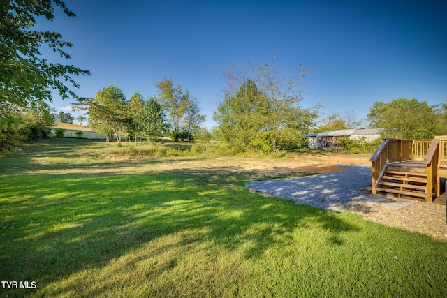 view of yard featuring a deck