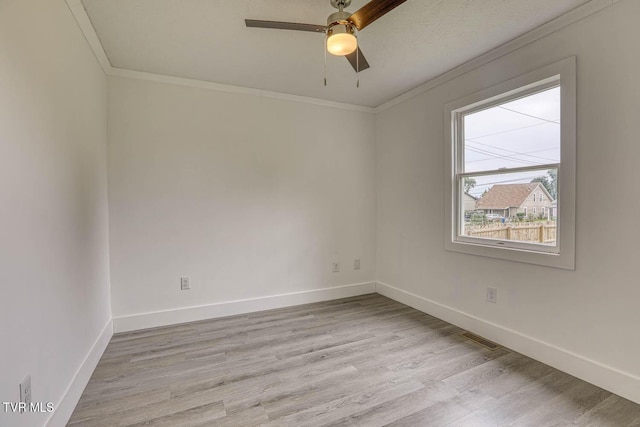 954 Maple St, Kingsport, TN 37660 - spare room featuring ornamental molding, light wood finished floors, and a ceiling fan