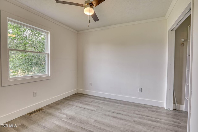 954 Maple St, Kingsport, TN 37660 - empty room with ceiling fan, light wood-type flooring, and crown molding