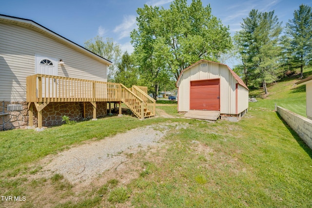 view of yard featuring an outbuilding, a deck, a shed, and stairway