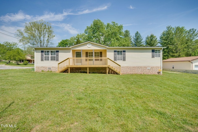 back of house featuring a lawn, crawl space, and stairs