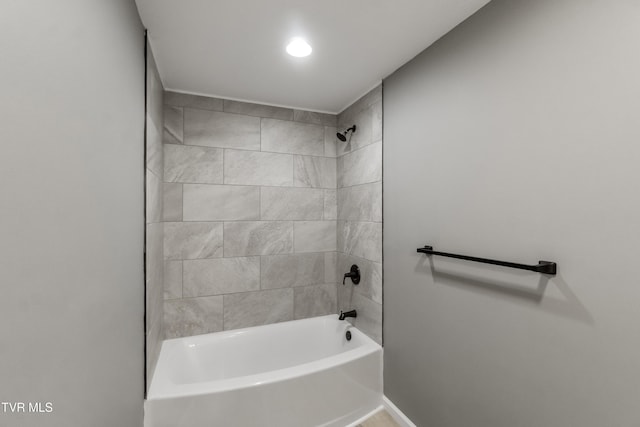 full bathroom with baseboards and bathing tub / shower combination