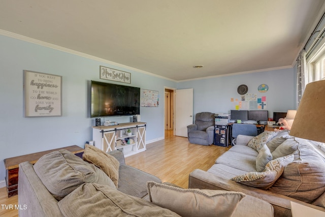 living room with baseboards, ornamental molding, and wood finished floors