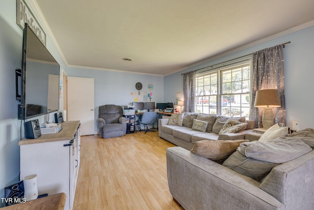 living room with light wood-style floors and ornamental molding