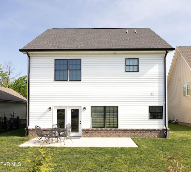 2834 Mccoy St, Kingsport, TN 37664 - rear view of house featuring a lawn, fence, a patio area, and roof with shingles