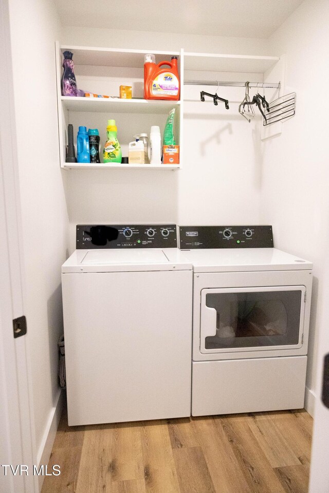 2834 Mccoy St, Kingsport, TN 37664 - washroom featuring laundry area, wood finished floors, and washer and clothes dryer