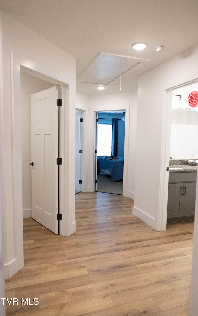 2834 Mccoy St, Kingsport, TN 37664 - corridor with baseboards, attic access, and light wood-type flooring