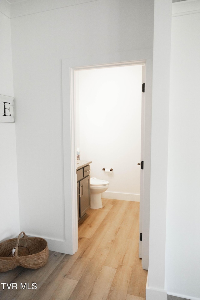 2834 Mccoy St, Kingsport, TN 37664 - bathroom with vanity, baseboards, toilet, and wood finished floors
