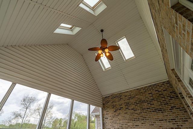 interior details featuring a skylight and ceiling fan