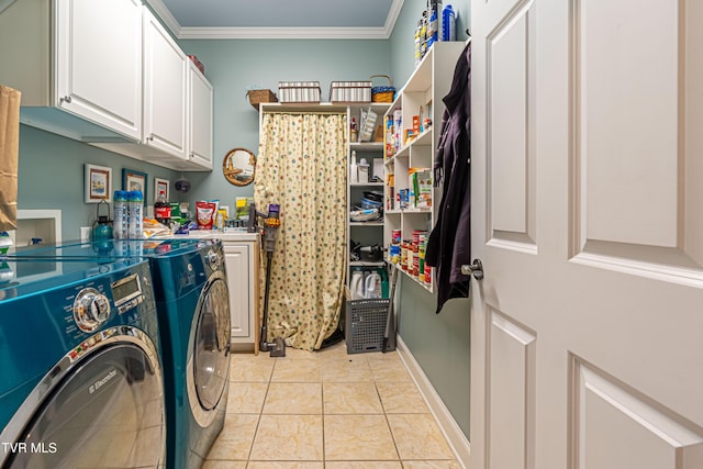 laundry room featuring cabinet space, separate washer and dryer, baseboards, light tile patterned floors, and ornamental molding
