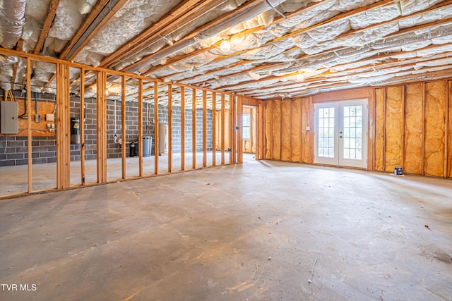 below grade area with water heater and electric panel