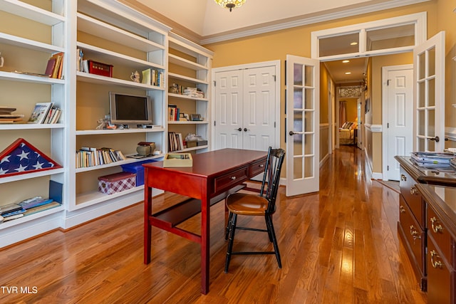 office space featuring french doors, ornamental molding, and wood finished floors