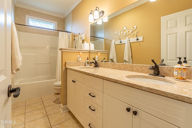 full bathroom featuring double vanity, toilet, tile patterned floors, and a sink