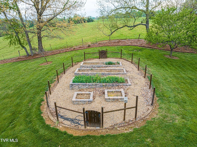 view of yard with fence and a garden