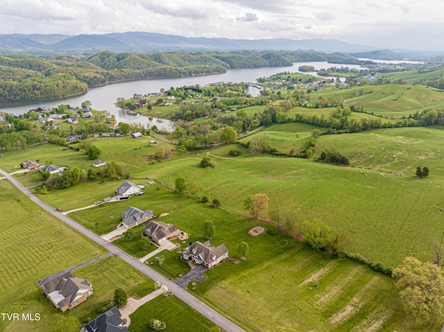 drone / aerial view with a water view and a rural view