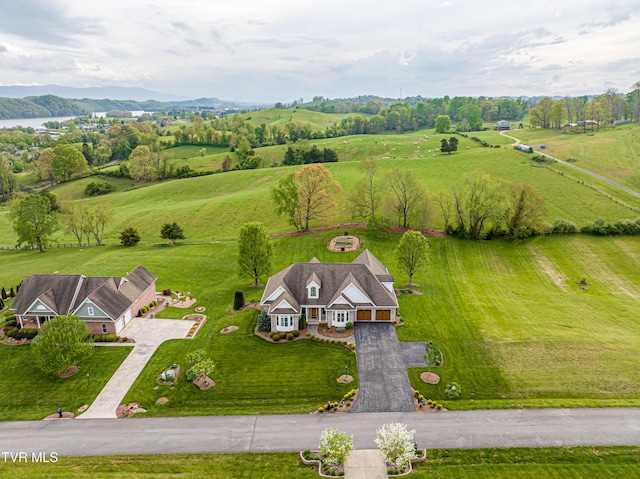 birds eye view of property with a rural view