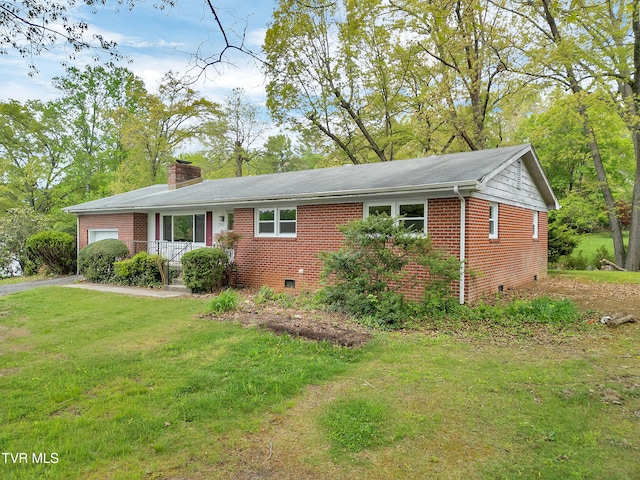 ranch-style home with a front lawn, brick siding, a garage, crawl space, and a chimney