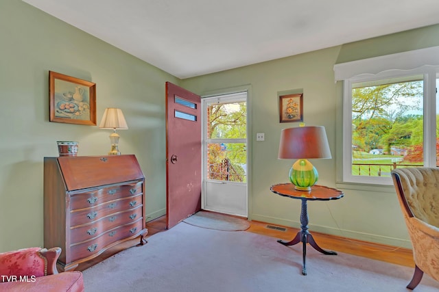 sitting room featuring baseboards and visible vents