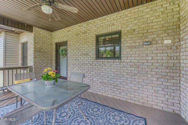 exterior space featuring a ceiling fan, outdoor dining area, and a wooden deck