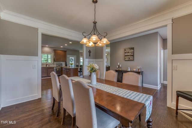 dining space with baseboards, a chandelier, ornamental molding, and dark wood-type flooring